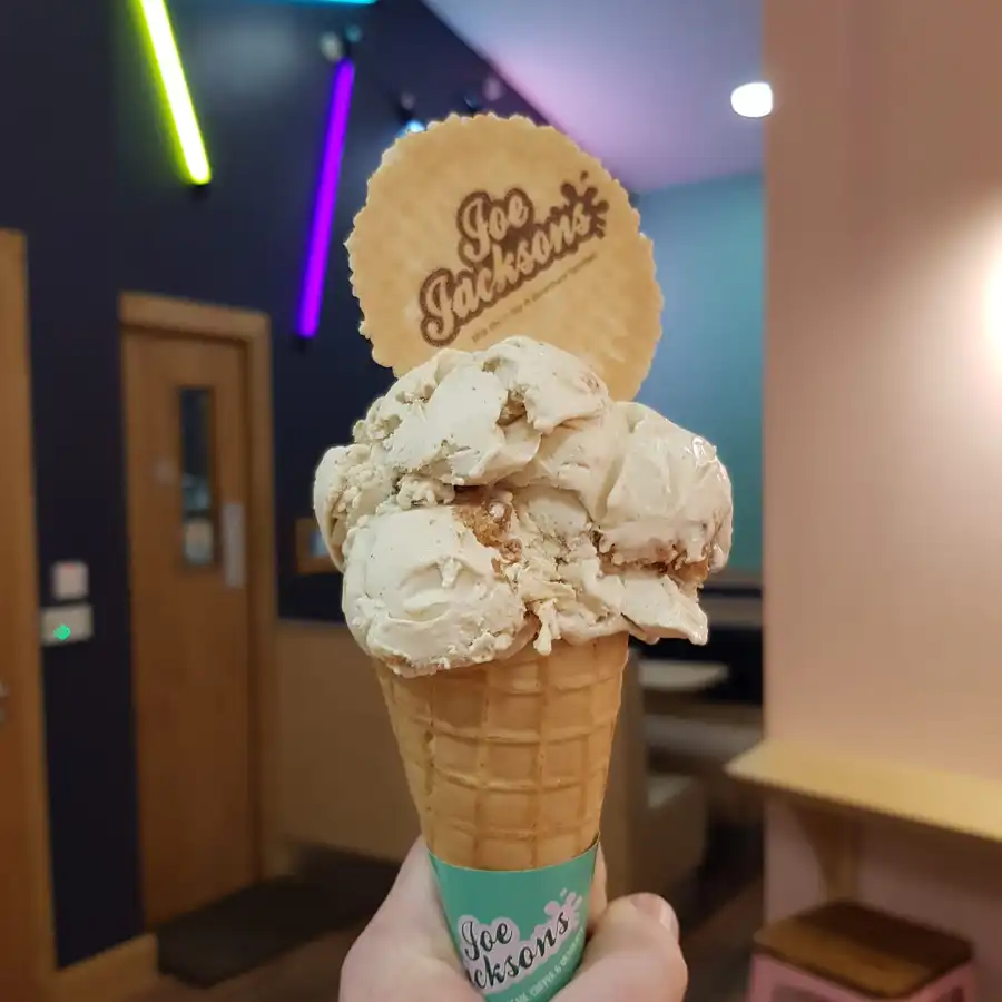 Cappuccino ice cream in a cone and a wafer with joe jackson name on it