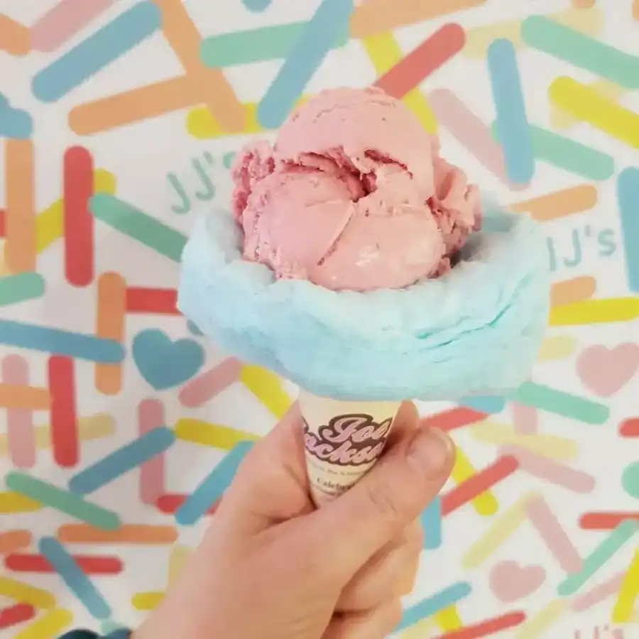 Strawberry scoop in a cloud candy floss cone