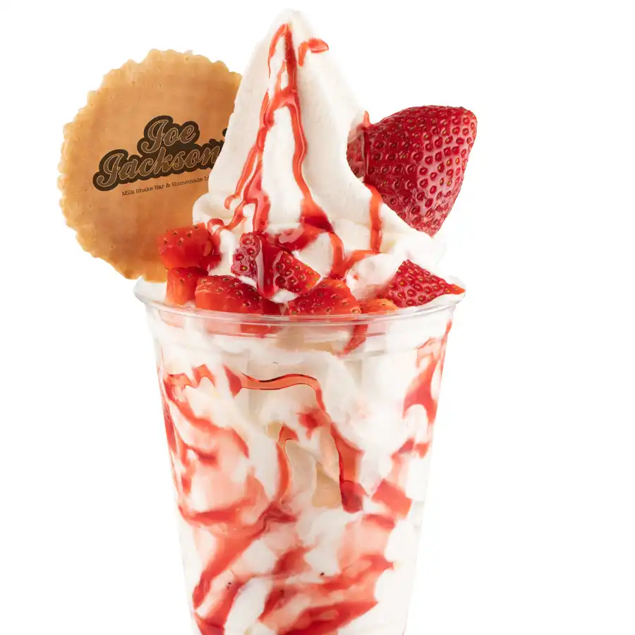 Strawberry sundae with strawberry sauce topped with strawberries and wafer with joe jackson written on it